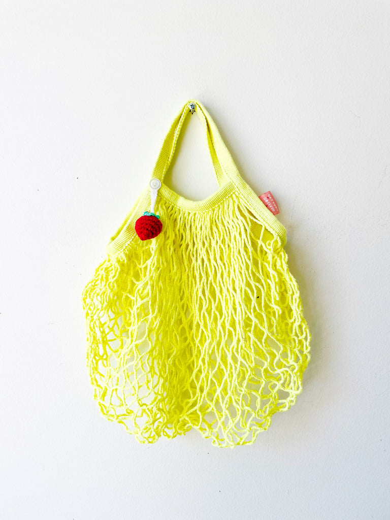 Tiny French net bag with strawberry crochet charm