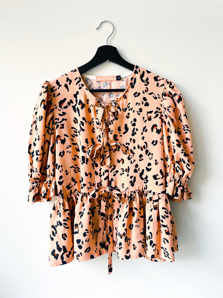 The Fancy Suki Peplum In Jaguar Print